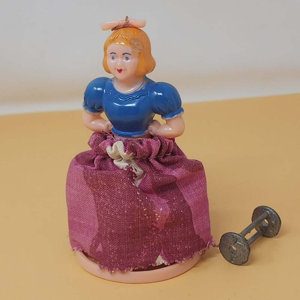 Vintage Hard Plastic Wind-Up Toy Doll With Blue‎ Top & Pink Fabric Skirt